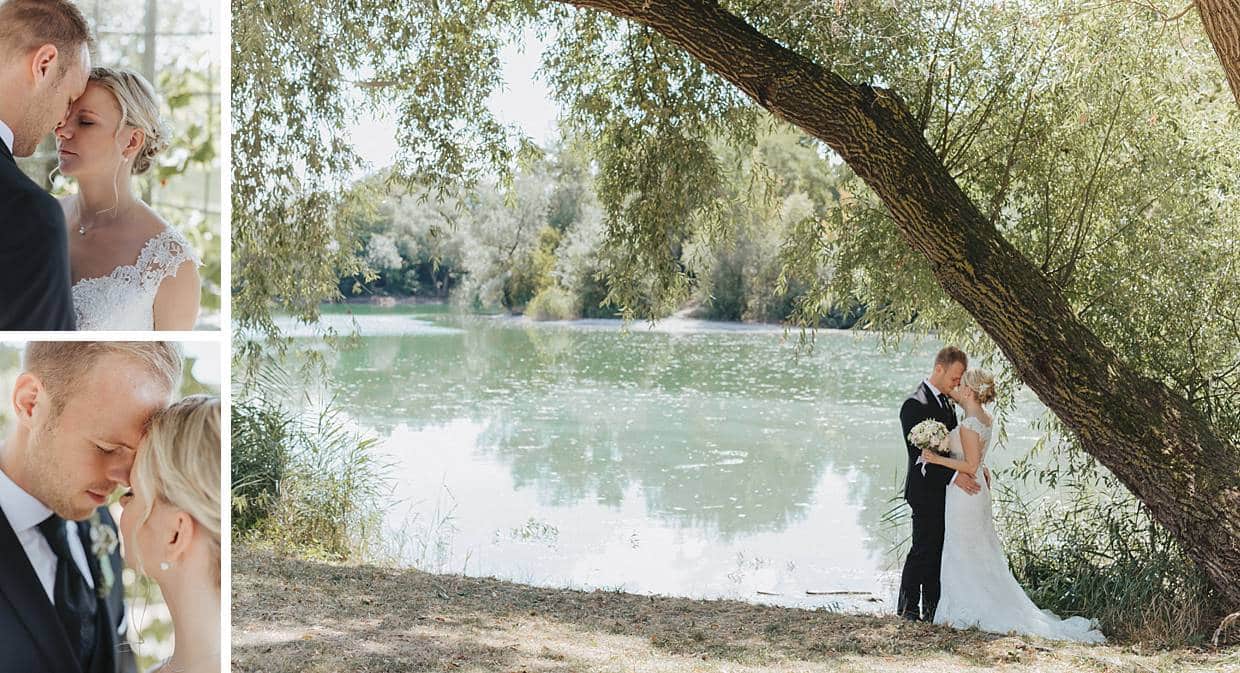 Hochzeitspaar in Lenzberg vor einem See.